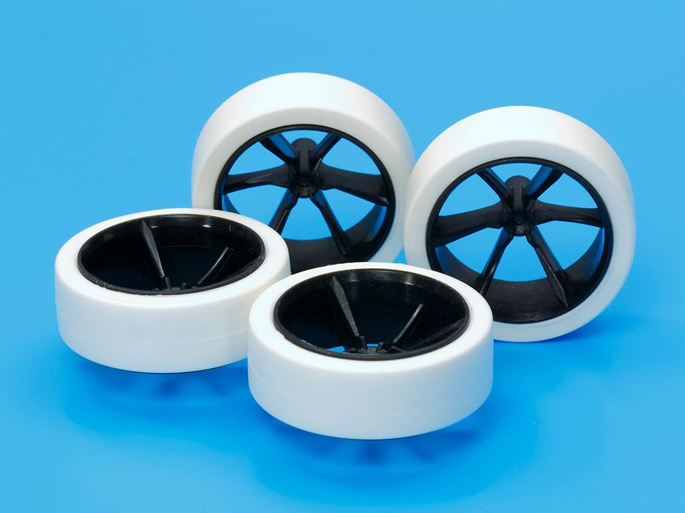 Hard Large Dia. Low-Profile Tires & Carbon 6-Spoke Wheels.