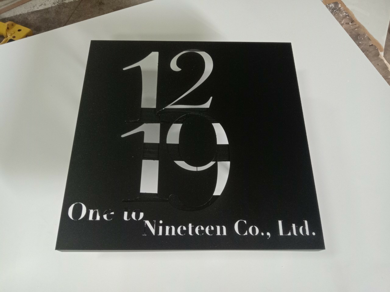 งานป้ายบ้านเลขที่_1219 One to Nineleen Co.,Ltd.