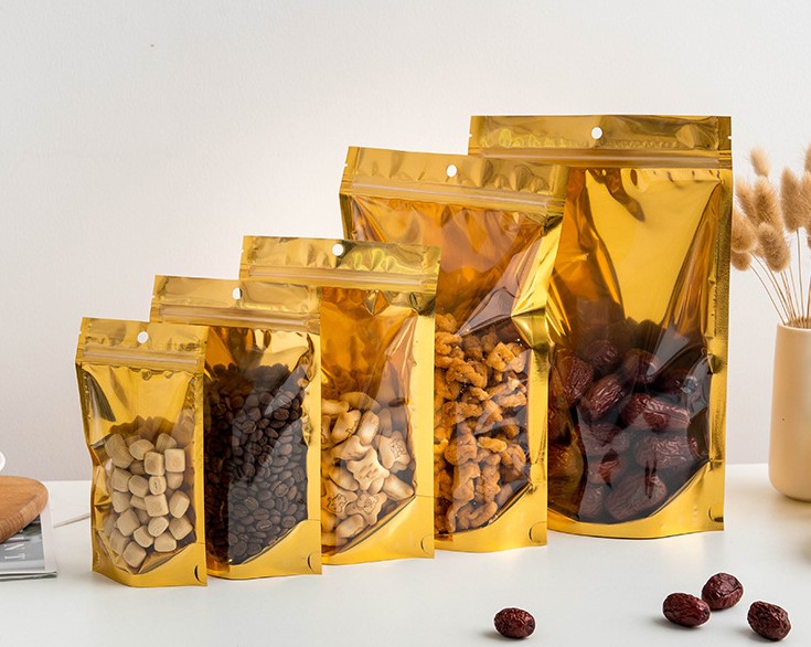ถุงฟอยล์ซิปล็อคตั้งได้ หน้าใสหลังฟอยล์สีทอง (เมทัลไลท์)