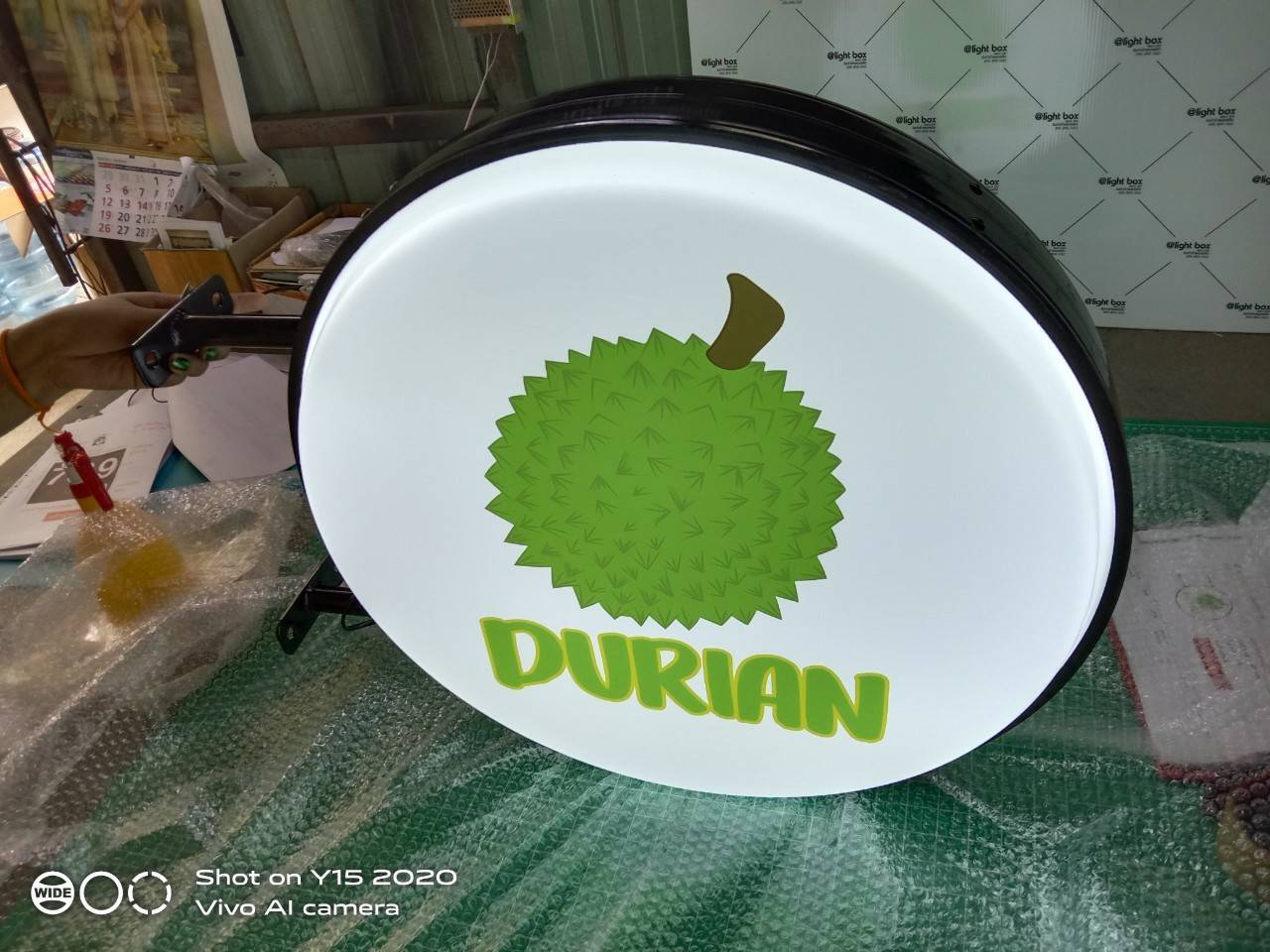 งานป้ายกล่องไฟวงกลมไฟออกทั้ง 2 ด้าน ขอบซิงค์พ่นสีดำ - DURIAN