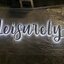 งานป้ายสแตนเลสตัวอักษรพ่นสีดำ ไฟออกหลัง The Leisurely House
